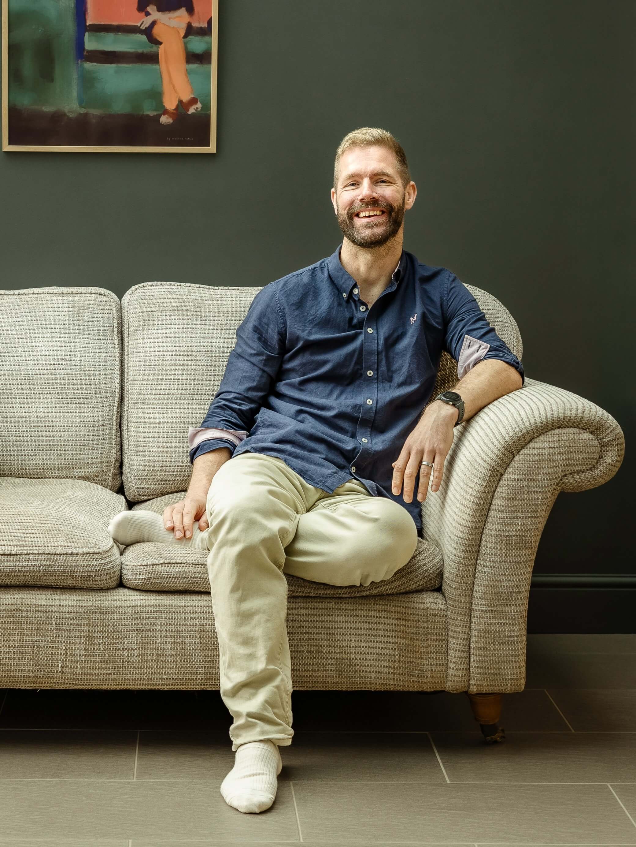 Nick sitting on sofa.
